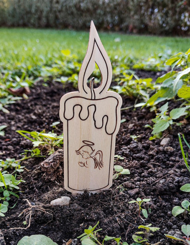 Personalized wooden memorial candle placed at a gravesite