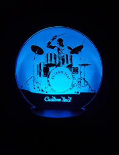 Custom drummer LED lamp showing engraved drums and sticks, illuminated with multicolor lights. 2