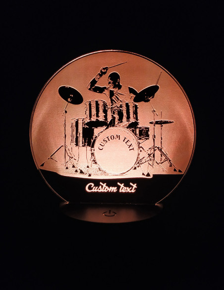 Custom drummer LED lamp showing engraved drums and sticks, illuminated with multicolor lights.