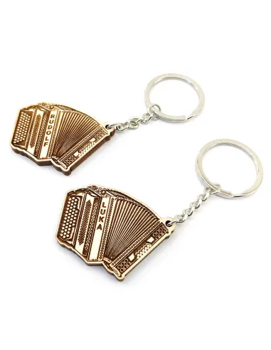 Comparison of Slovenian and Austrian button accordion keychains side by side