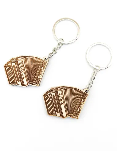 Comparison of Slovenian and Austrian button accordion keychains side by side