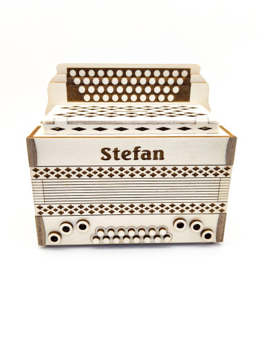 Handmade accordion-themed coin bank with detailed button layout