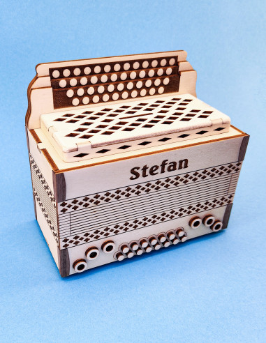 Personalized wooden accordion money box with engraved name on front