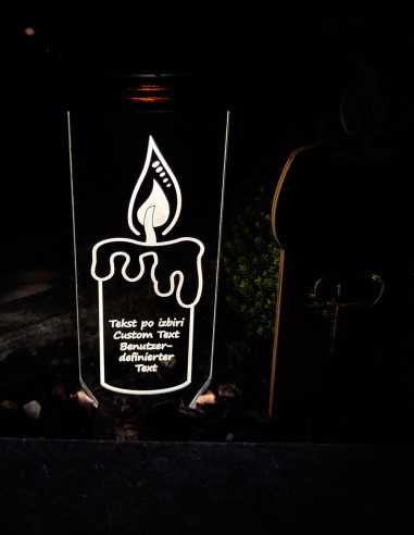 Outdoor grave decoration with glowing flame design and ground stake