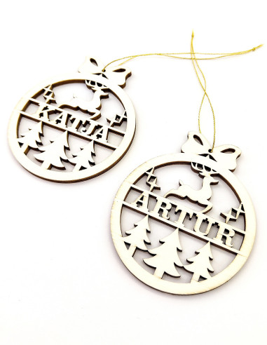 Round Christmas ornament with reindeer, trees, and name cutout