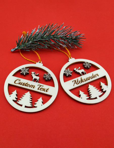 Personalized Christmas ornament featuring moose, snowflakes, and engraved name