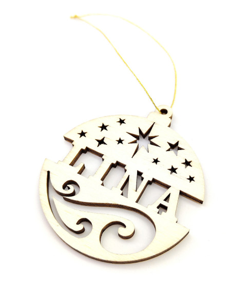 Close-up of personalized wooden Christmas ornament with cutout stars and name