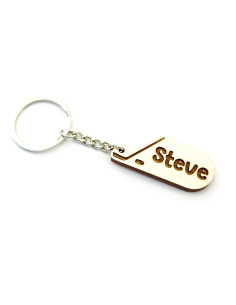 Personalized hockey keychain with custom name engraved beside stick and puck