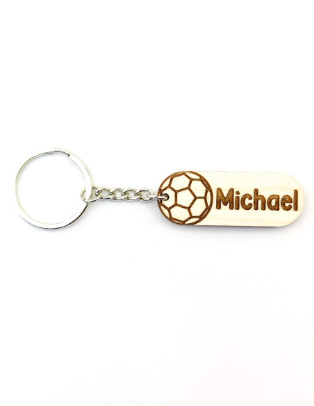 Handball keychain with engraved name placed next to the ball