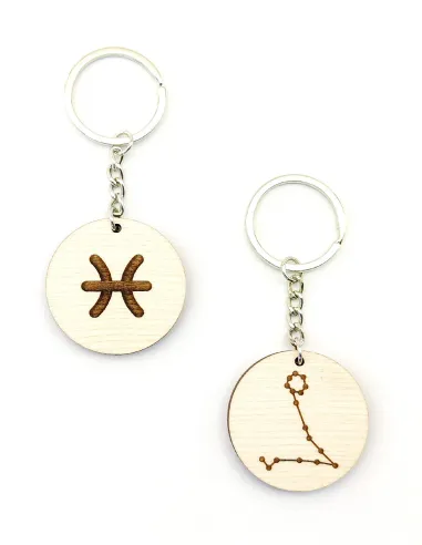 Two Pisces zodiac keychains with different engraved designs