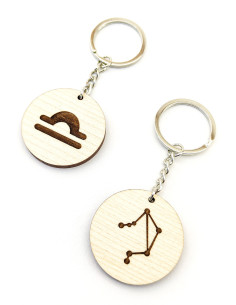 Two engraved Libra keychains with zodiac-themed designs
