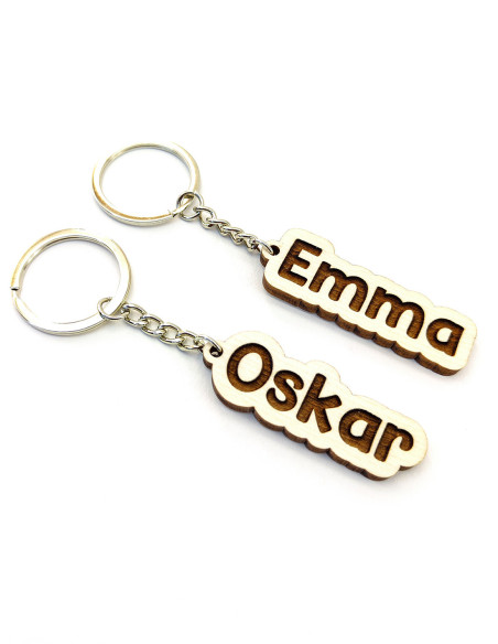 Custom engraved name keychains in bold comic-style font