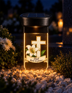 Personalized cross and lily solar grave candle glowing at night with Dad Rest in peace memorial message