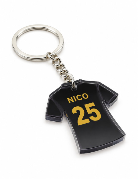 Acrylic football jersey keychain – black design with gold lettering, NICO 25; angled view on white