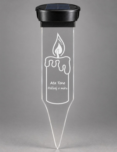 Personalized solar grave candle with engraved flame design and clear ground stake on a grey background