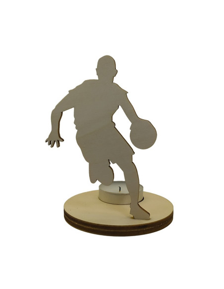 Wooden candle holder of a basketball player dribbling