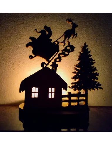 Scène de Noël illuminée avec silhouette de traîneau et sapin