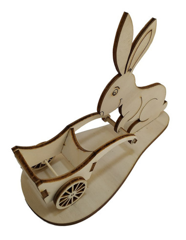 Laser-cut plywood bunny pushing a wheelbarrow for easter eggs