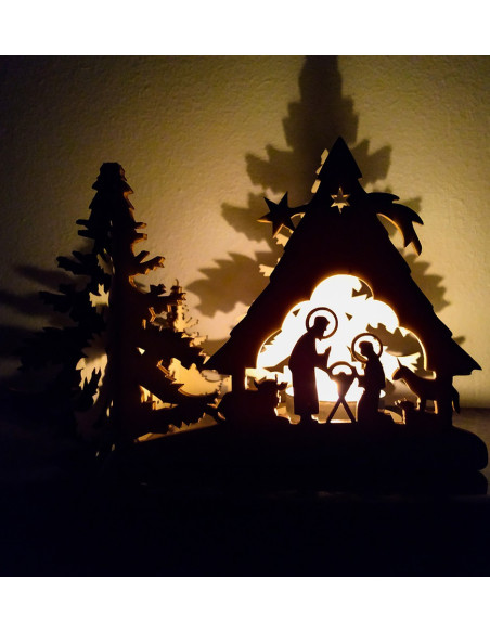 Layered silhouette candle holder featuring Mary, Joseph, and baby Jesus